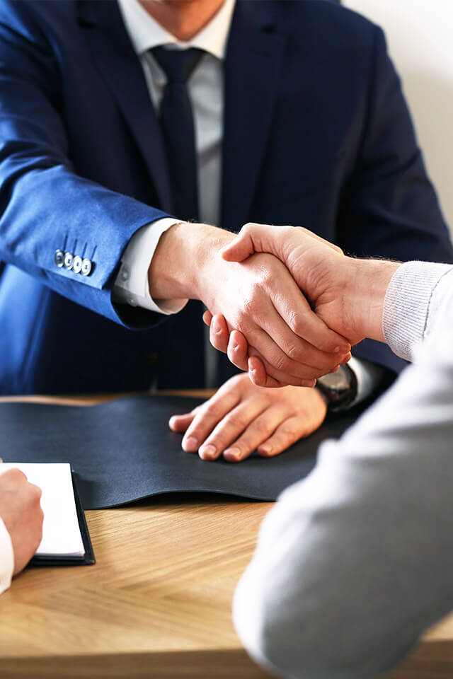 Kimura London & White LLP team handshake with a client